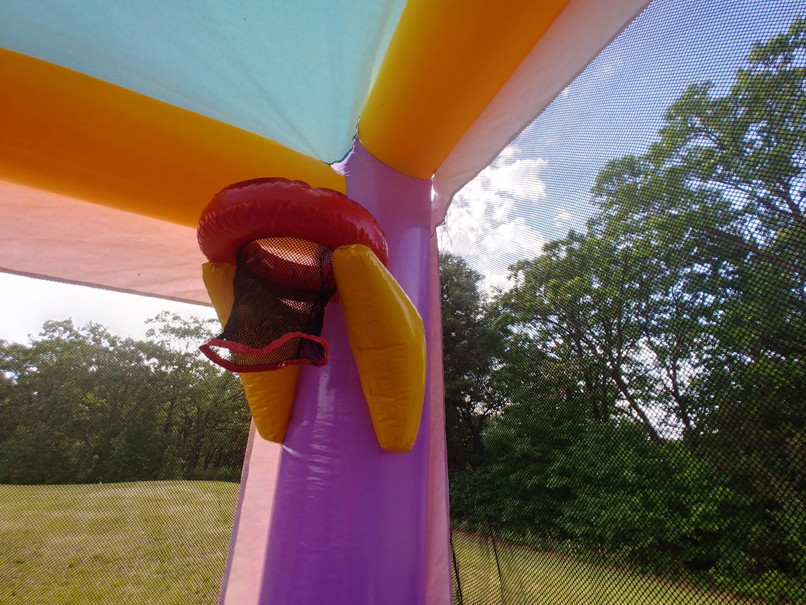 Inflatable basketball hoop inside bounce house